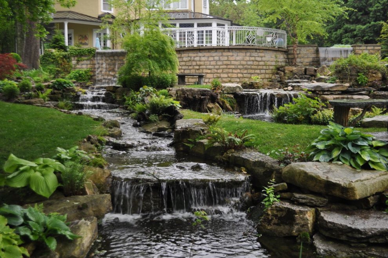 paysagiste-REVEST LES ROCHES-min_landscaping-rock-louisville-ky-traditional-landscape-and-boulders-brick-wall-bushes-grass-koi-law